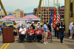 The color guard presents the colors at the opening ceremony on the Roberto Clemente Bridge.