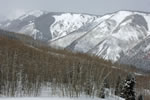 Outdoor scenic view of the snow covered mountains surrounding Snowmass.