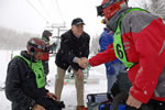 Deputy Secretary of Veterans Affairs, W. Scott Gould, on the ski slopes shaking hands with Veterans and volunteers.