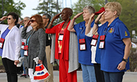 Women veterans saluting
