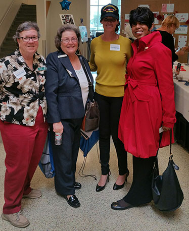 Marine attendees with Dr. Betty Moseley Brown, Associate Director, Center for Women Veterans.