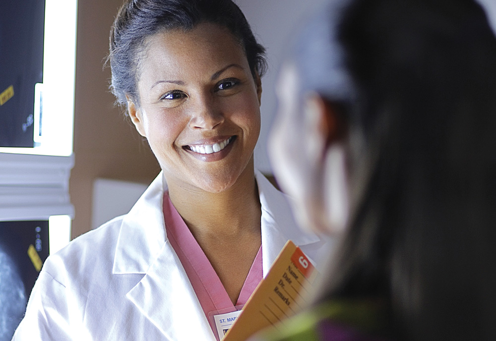 A female doctor speaking with a female patient about her heart health A female doctor speaking with a female patient about her heart health