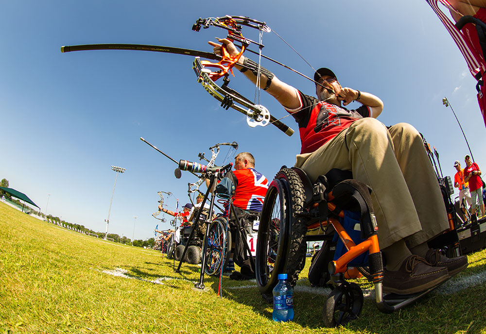 Veteran competeing in Wheelchair games in an Archery match. Veteran competeing in Wheelchair games in an Archery match.