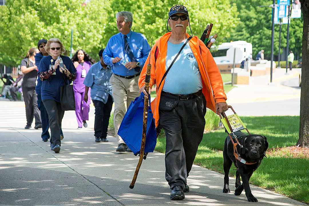Veteran walking a dog